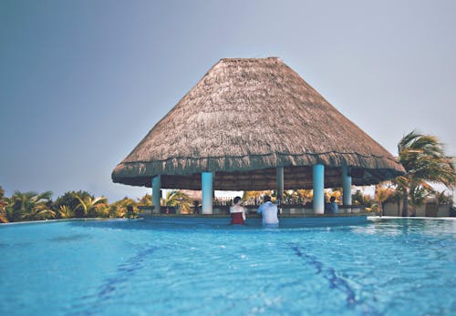 Free Brown Gazebo Surrounded by Pool Stock Photo