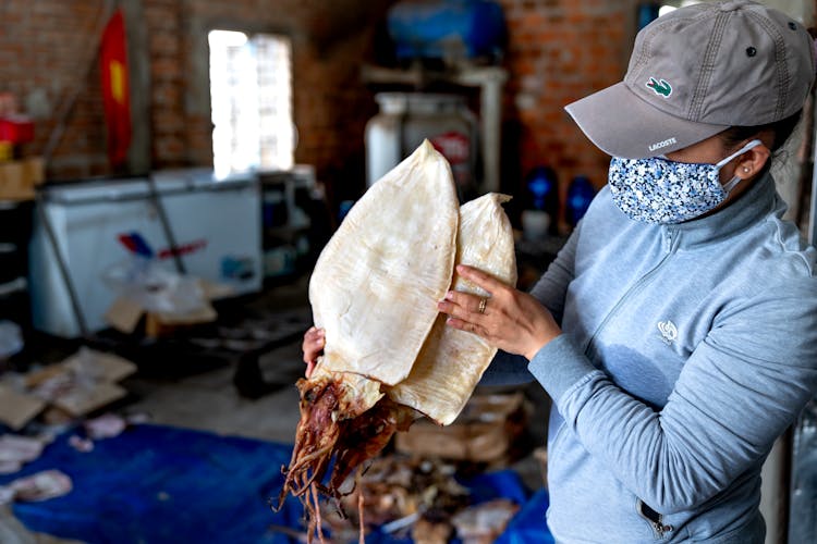 Woman Holding Fresh Fish 