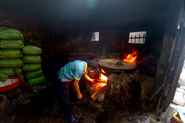 Person Cooking Using Firewood