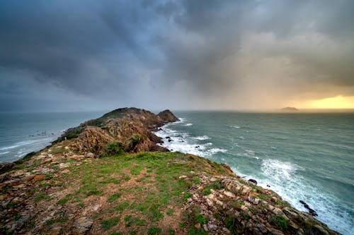 Photo of Sea under Dark Clouds