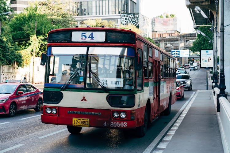 Red And White Bus On The Road