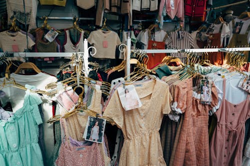 Assorted Children Display Clothes on Clothing Rack Inside a Boutique