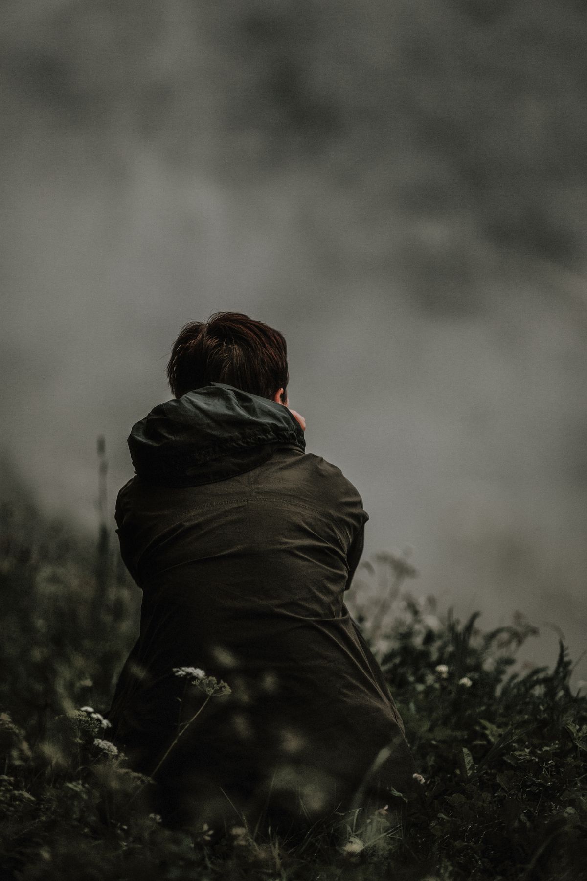 Man alone in thought, representing the private nature of mental health symptoms in many adult male patients