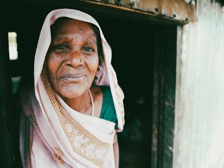 Smiling Woman At The Door 