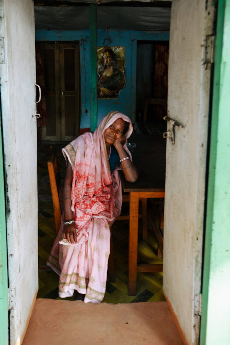 Woman Sitting With Open Door