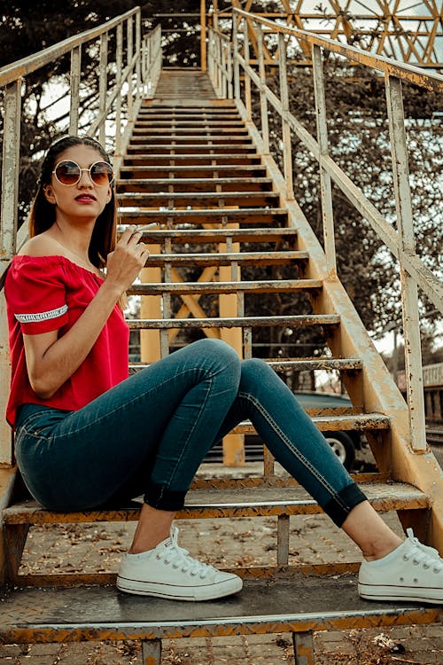 Free Woman Sitting on Stair Stock Photo