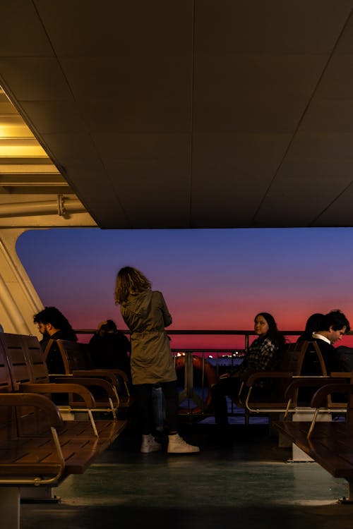 People Sitting on Chairs Inside Building