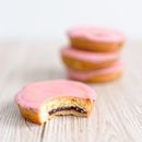Selective Focus Photography of Bitten Cake on Table Near 3 Stacks of Pastry