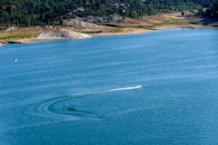 Boat Speeding On Blue Water