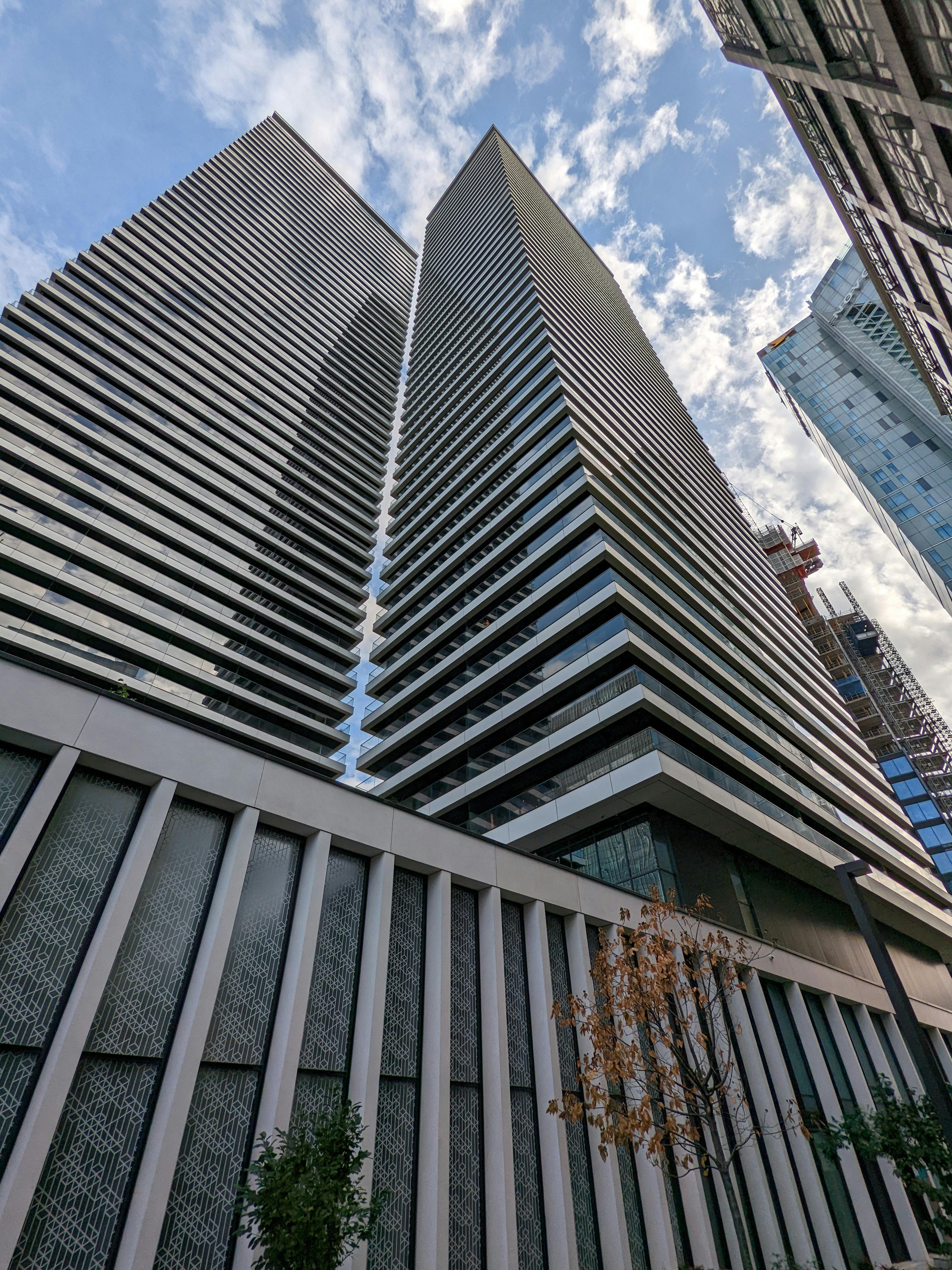 Gray Concrete Building Under Blue Sky · Free Stock Photo