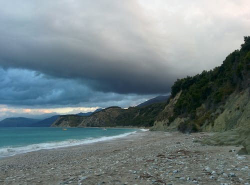 Shore Under Cloudy Sky