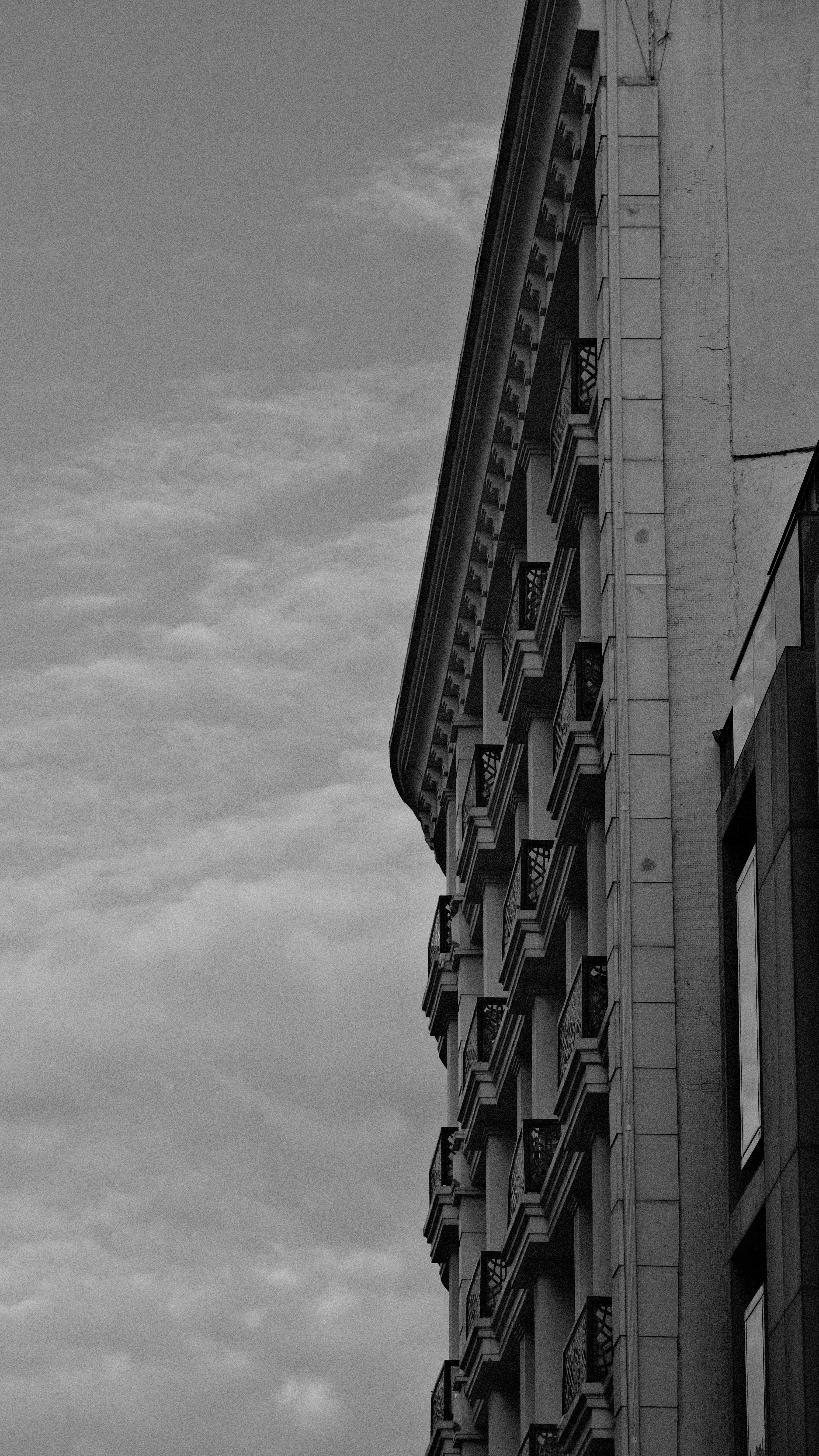 Grayscale Photo of a High-Rise Building · Free Stock Photo
