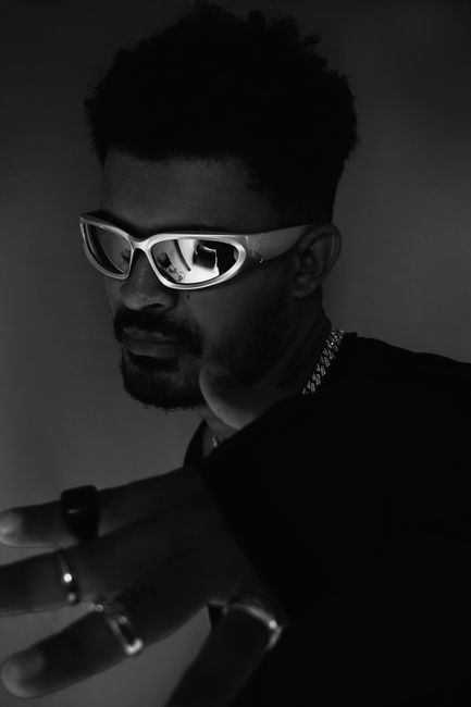 Captivating monochrome portrait of a man wearing sunglasses, shot in Recife.