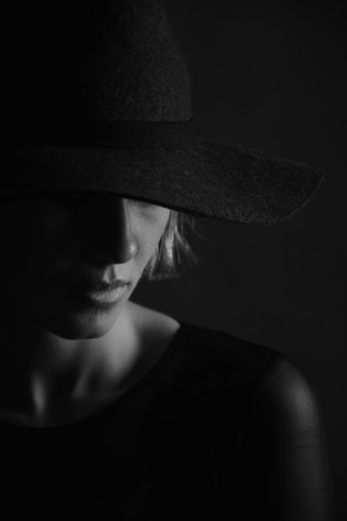 Monochrome Photo of a Woman with a Hat