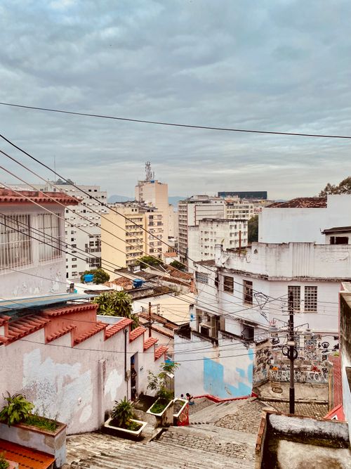 Free Urban view of vibrant stairs and buildings under an overcast sky. Stock Photo