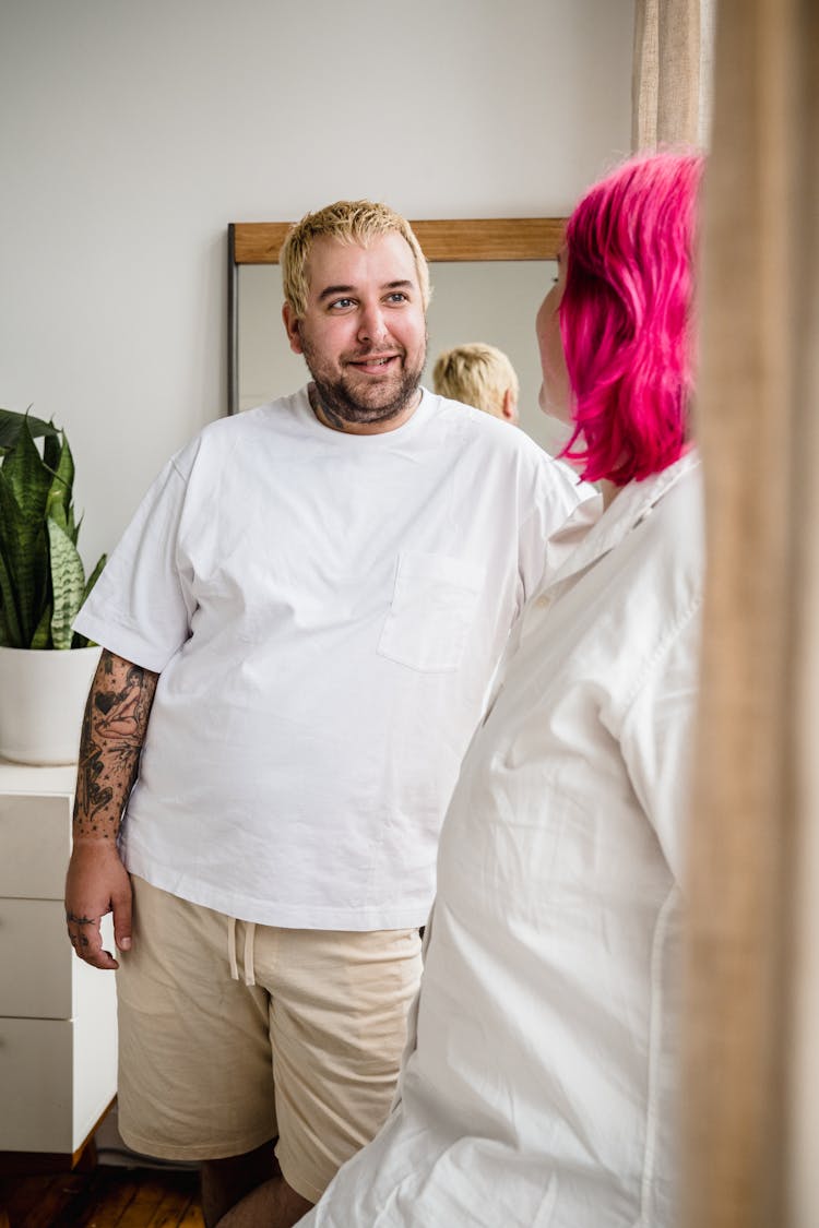 Man Talking With Woman With Pink Hair