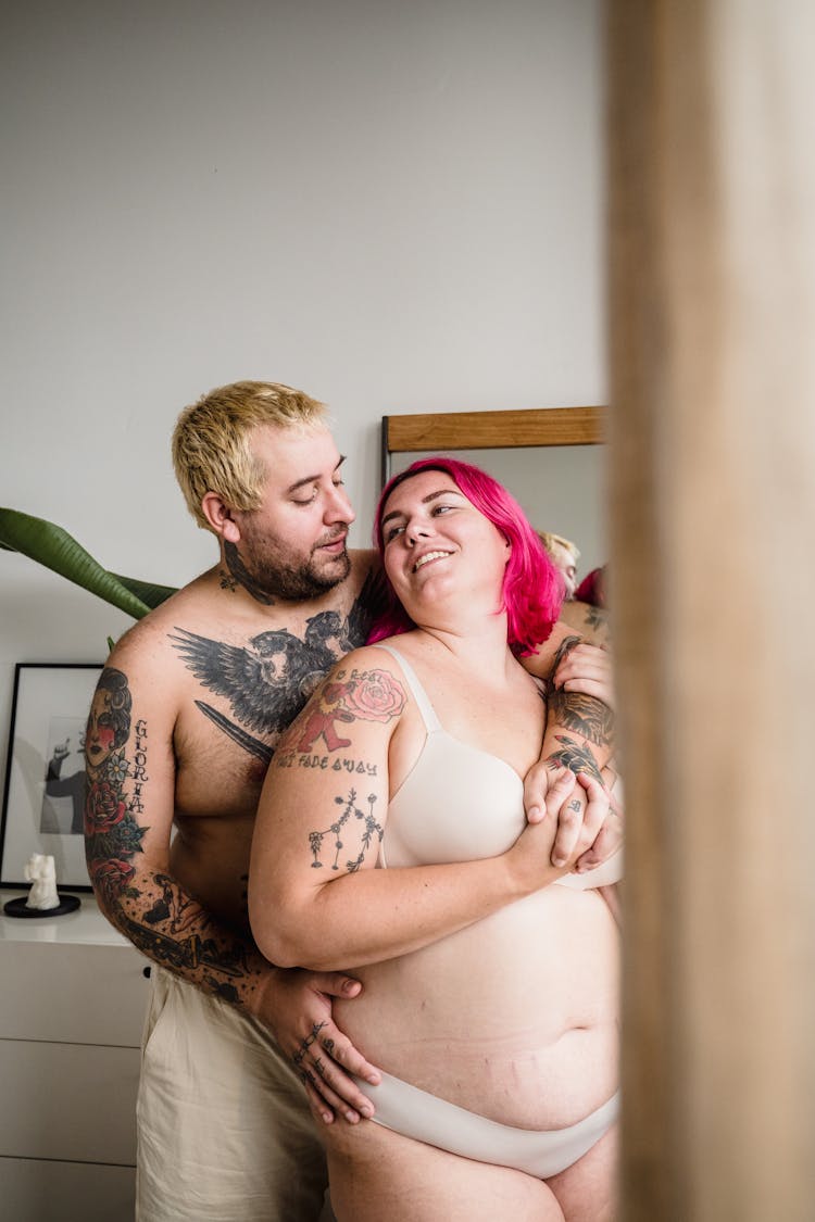 Body Positive Couple Hugging At Home