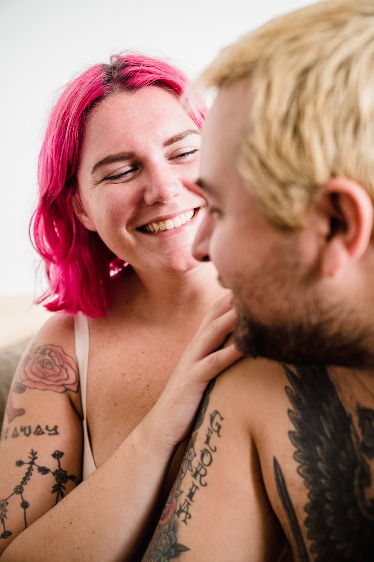 Close-up Of Smiling Eccentric Couple Hugging