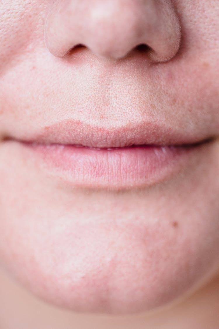 Close-up Of Womans Mouth In A Gentle Smile 