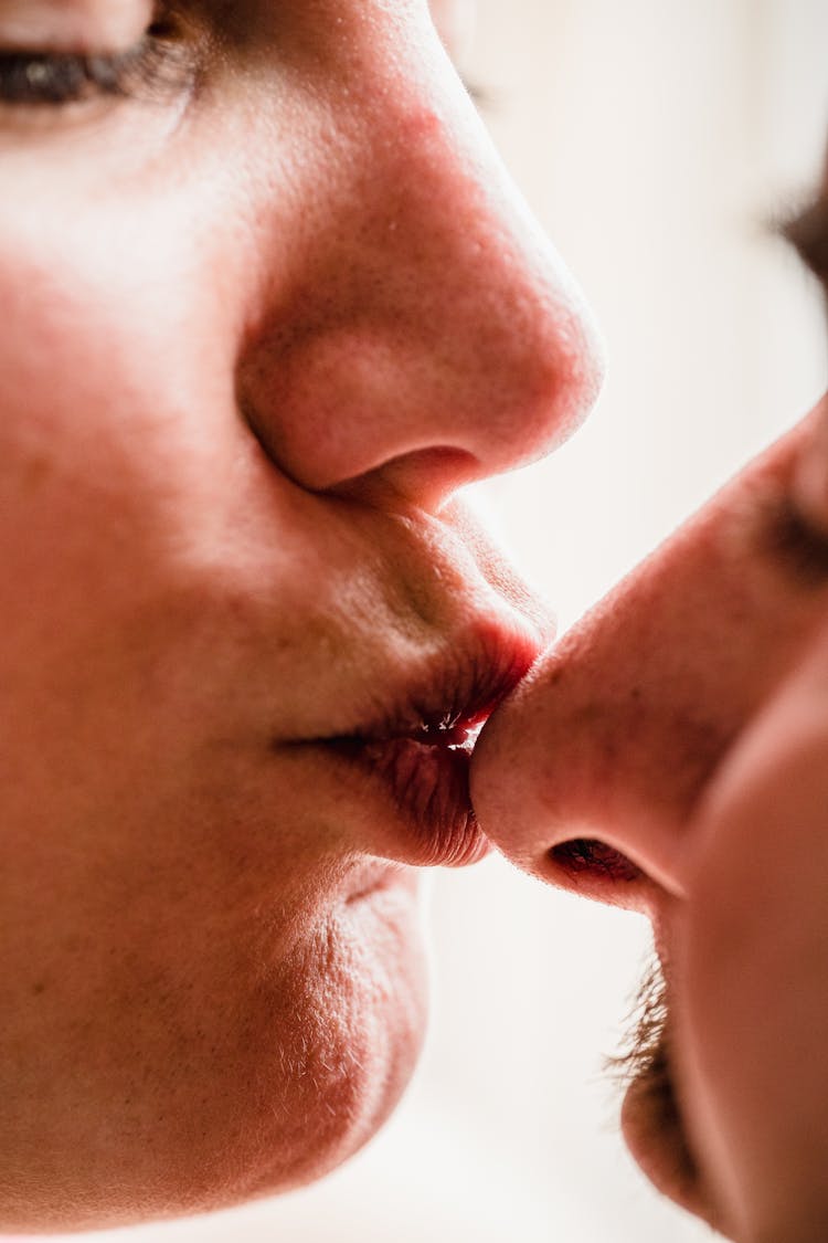 Woman Kissing A Man On The Nose