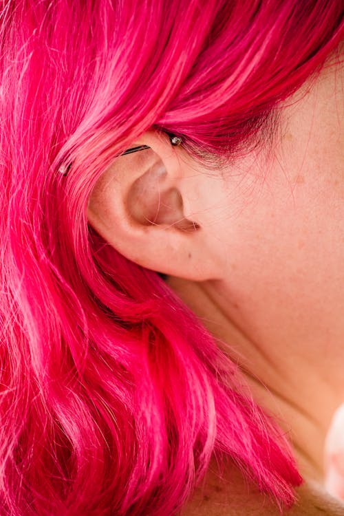 Free Close-up of Womans Ear and Pink Hair Stock Photo