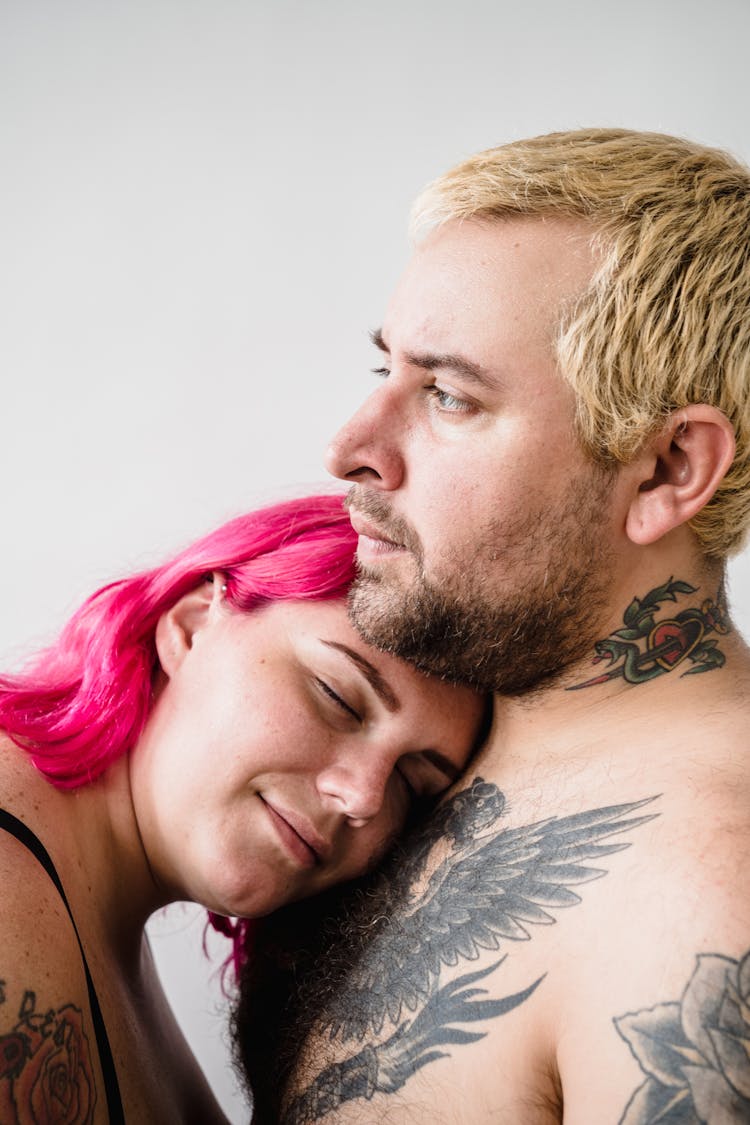 Smiling Woman Laying Her Head On Her Boyfriends Chest 