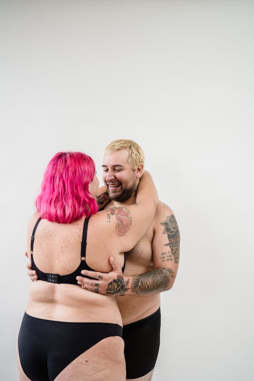 Stunning Couple In Underwear Posing For Camera Stock Photo