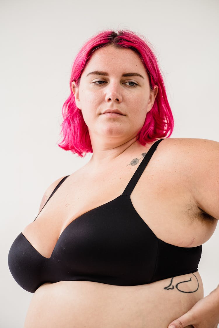 Woman With Pink Hair Wearing A Bra 