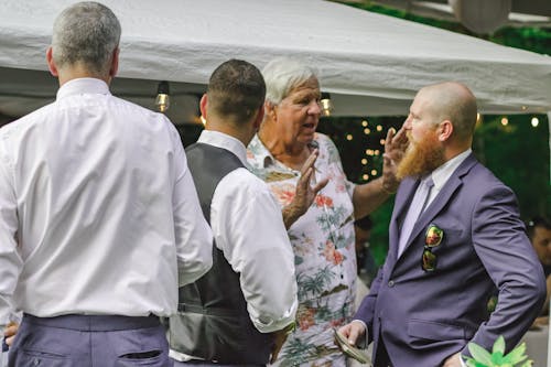 Four Man Standing Near Canopy Tent