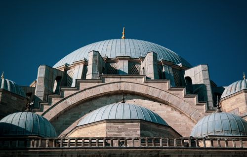Free Close-up of the Suleymaniye Mosque's dome under a clear blue sky, showcasing its architectural grandeur. Stock Photo
