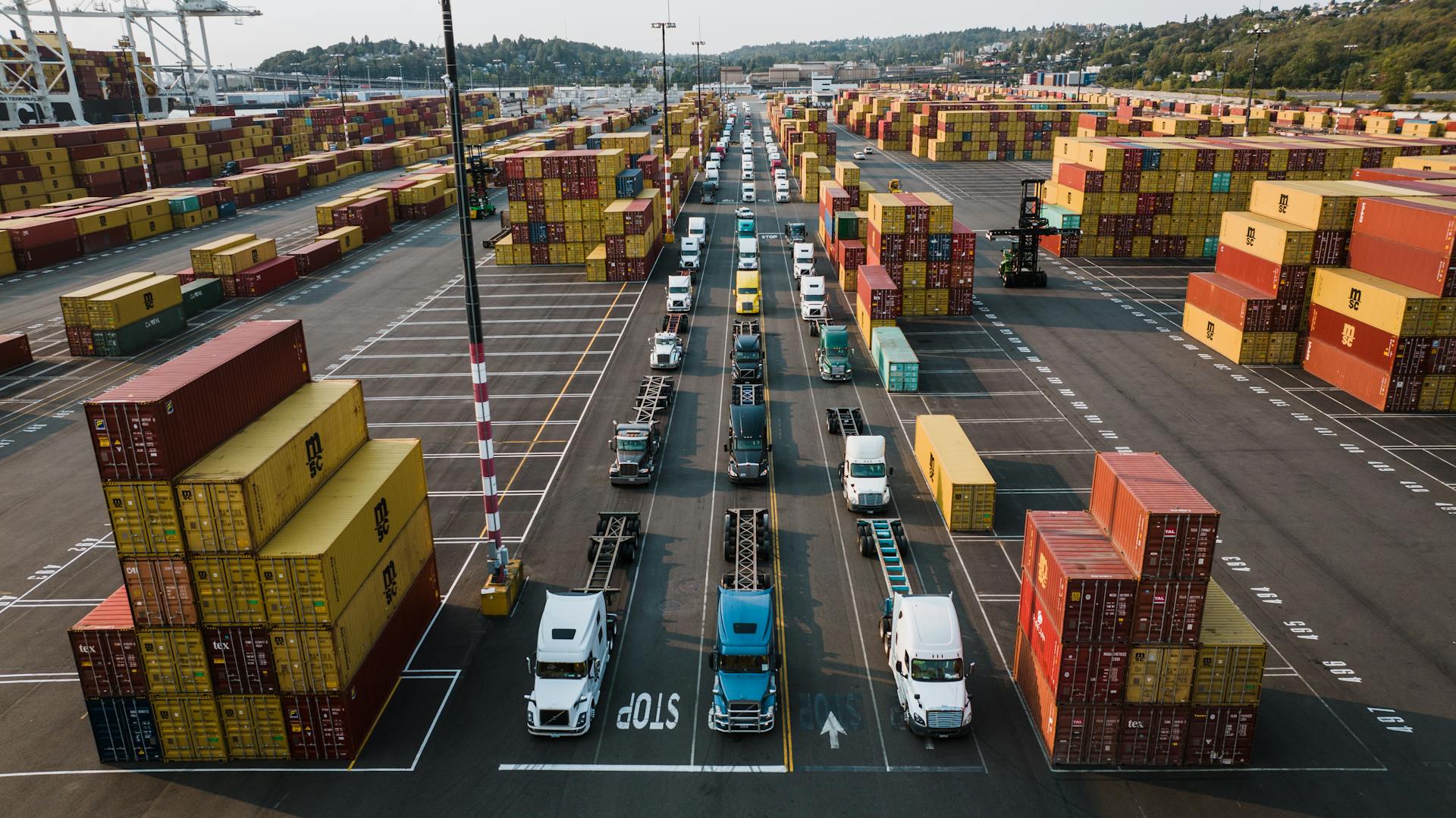 Parked Trucks and Cargo Containers on Port