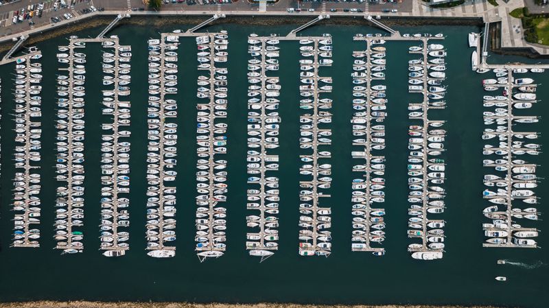 Aerial drone shot of Seattle marina with docked boats