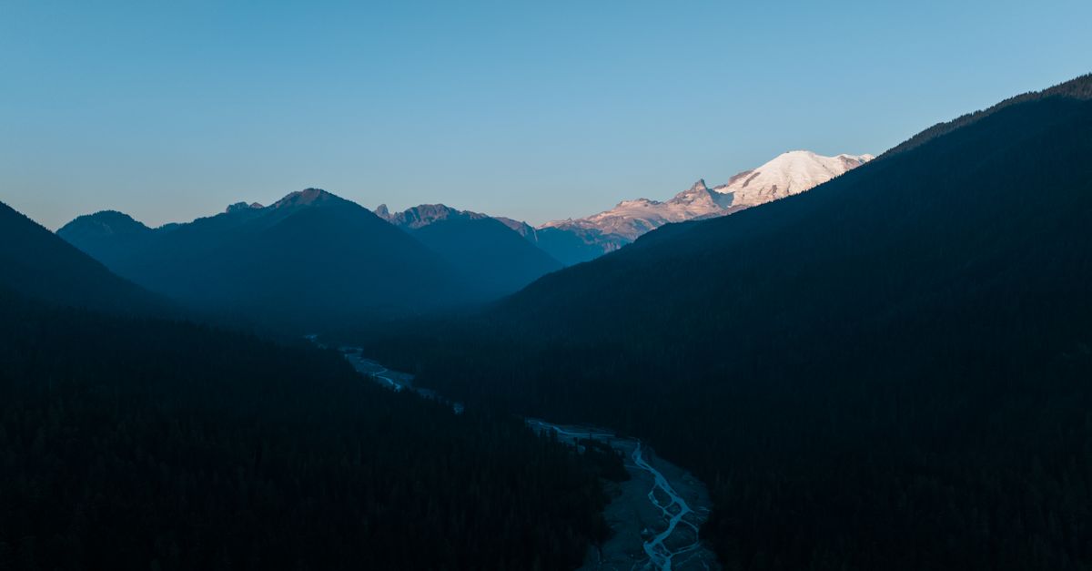 Stunning aerial view of Enumclaw mountains and river in Washington State during daylight.