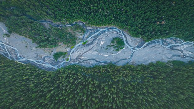 Stunning aerial shot of forest and river landscape in Sunrise, WA.