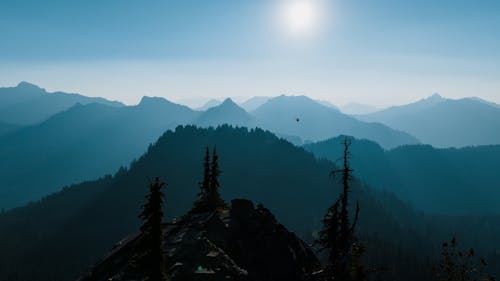 Aerial View of Silhouette of Mountains Under the Blue Sky