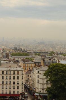 Aerial view of Paris cityscape showcasing historic buildings and skyline.
