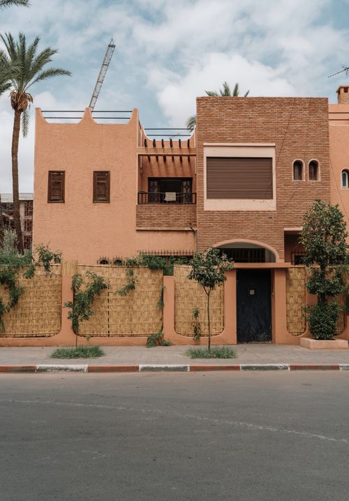 Free An elegant facade of a traditional Moroccan building in Marrakech, highlighting vibrant architectural style. Stock Photo