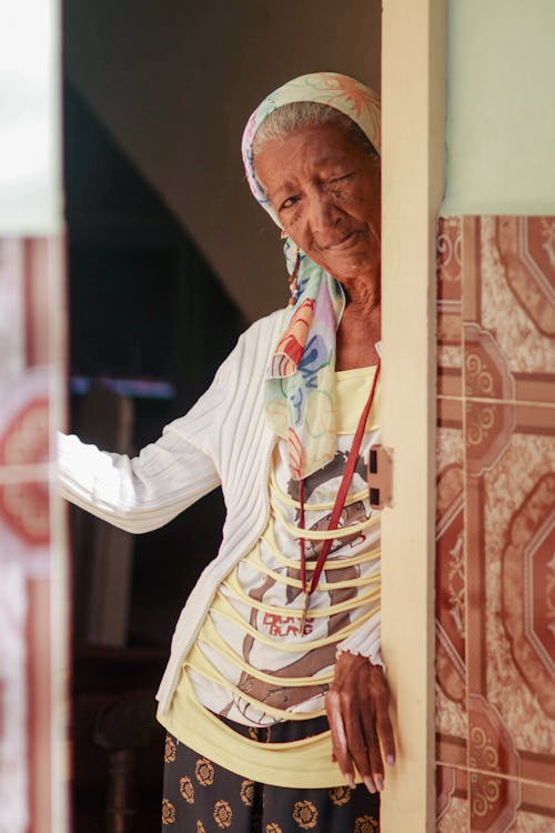 Elderly Woman Standing in the Doorway 