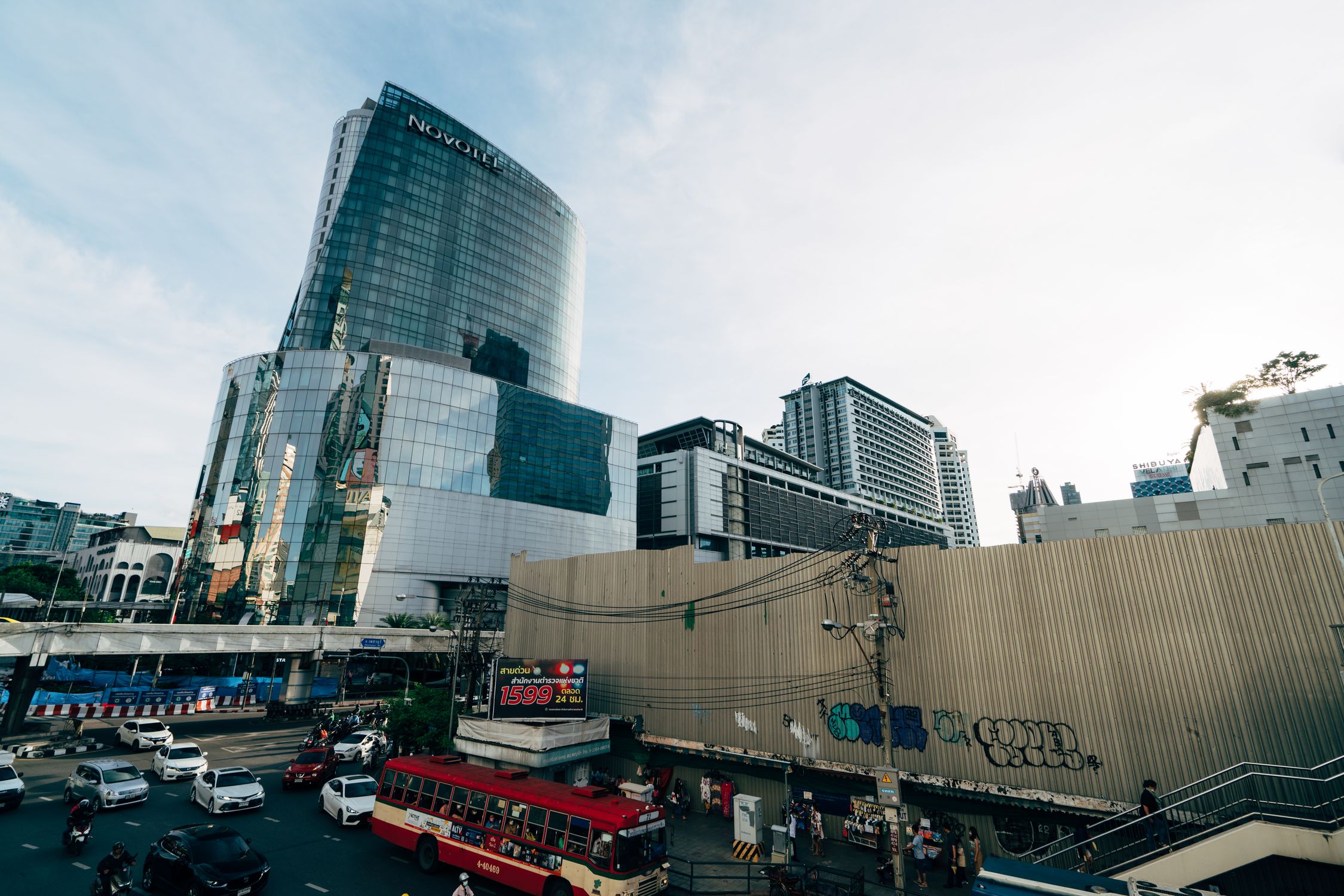 View of modern skyscrapers and bustling traffic in Bangkok, Thailand.