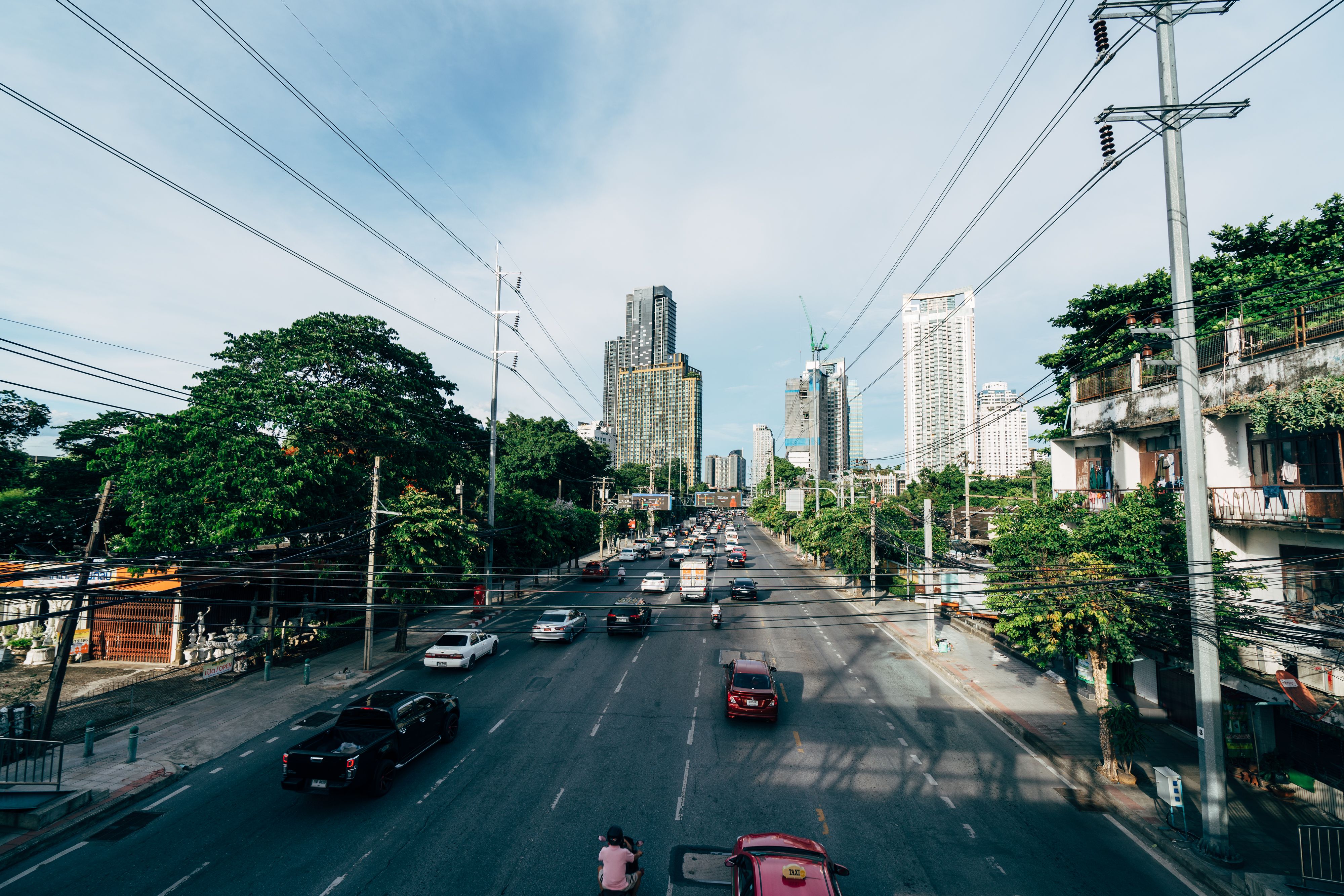 Cars on Road Between High Rise Buildings · Free Stock Photo