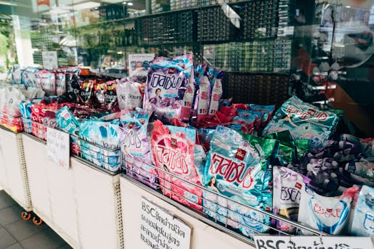 Colorful display of various laundry detergent brands in a retail store setting.