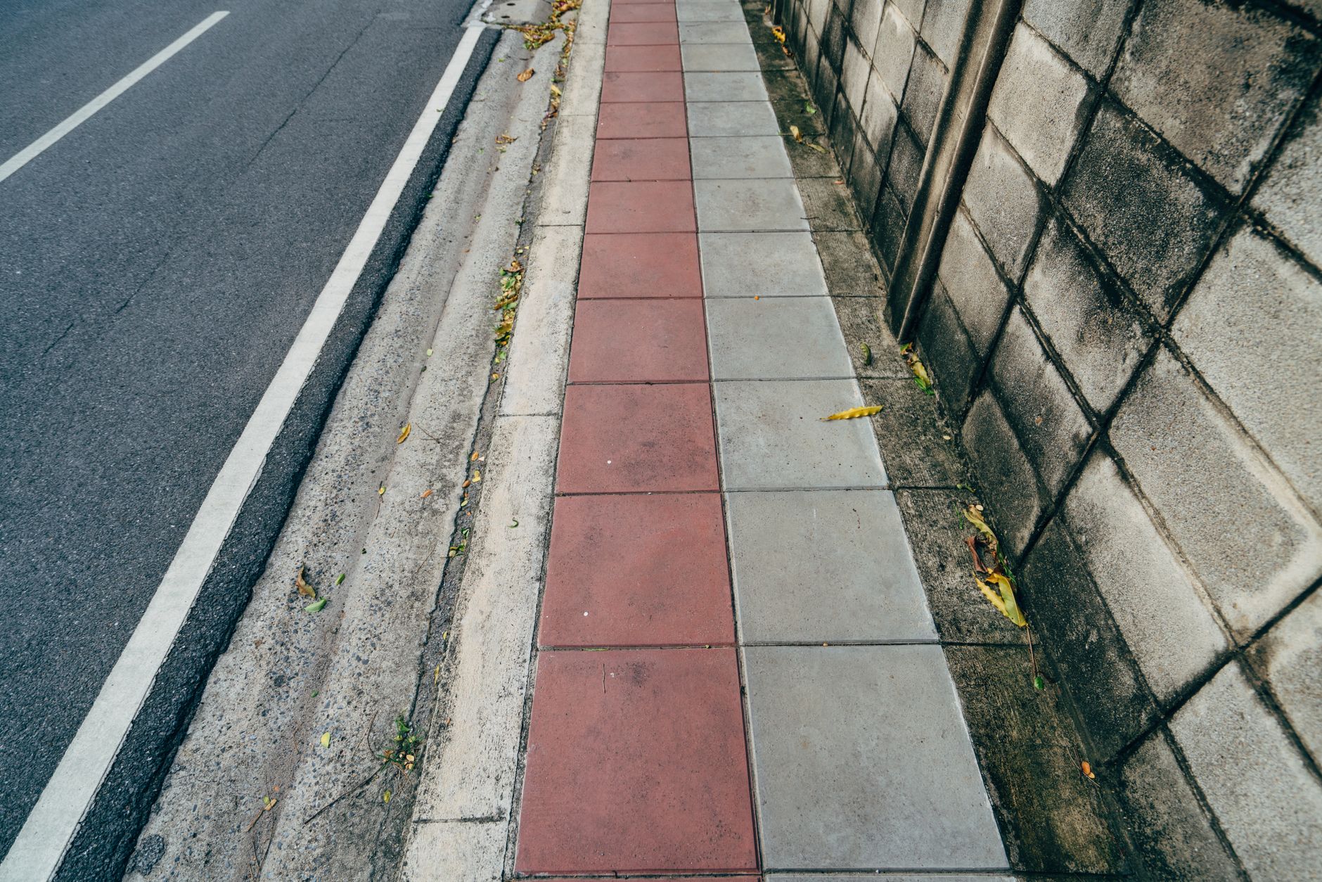 Concrete sidewalk being repaired in front of a Hoboken rowhouse