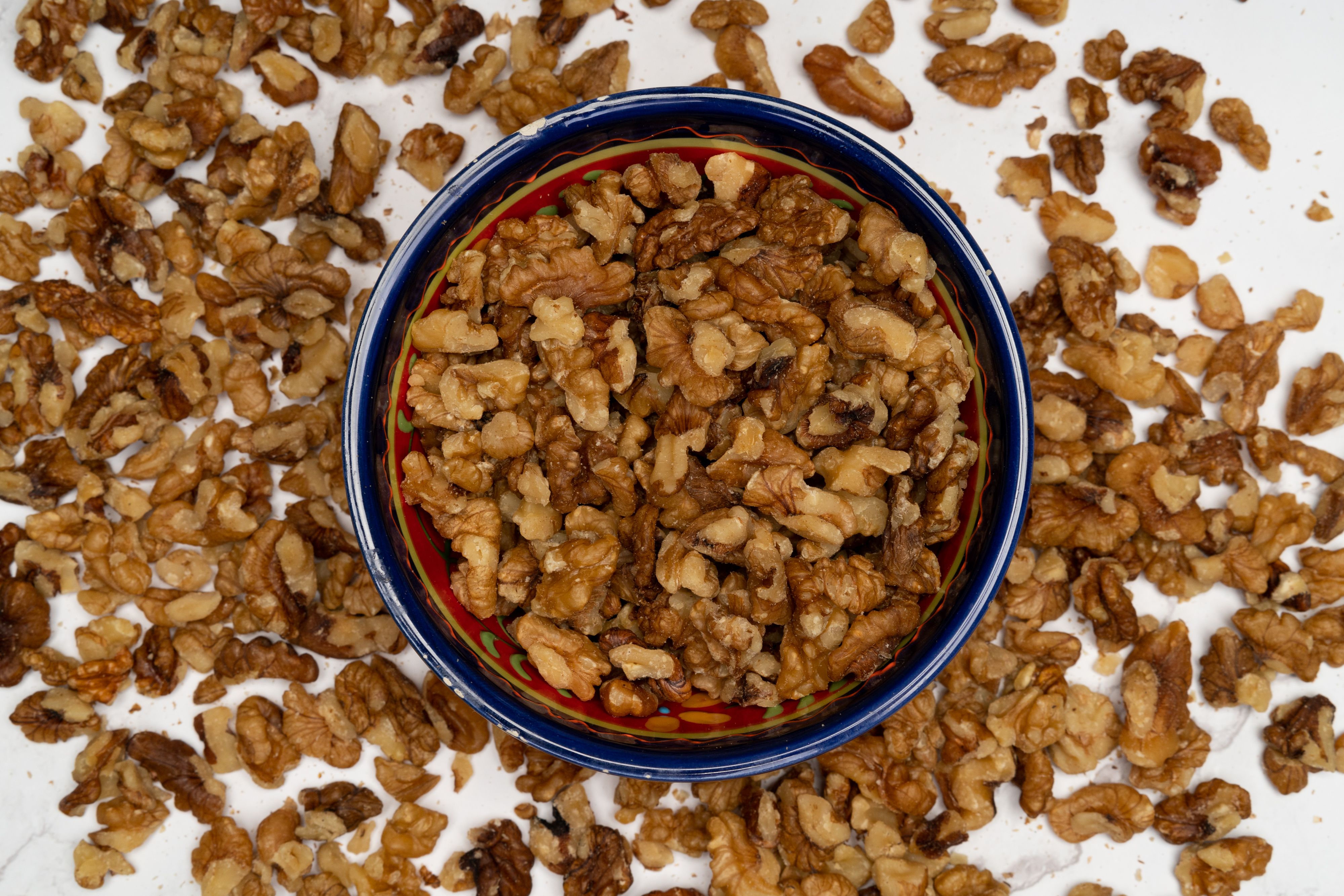 a textured mix of brown lentils and walnuts in a bowl, ready to be added to a sauce