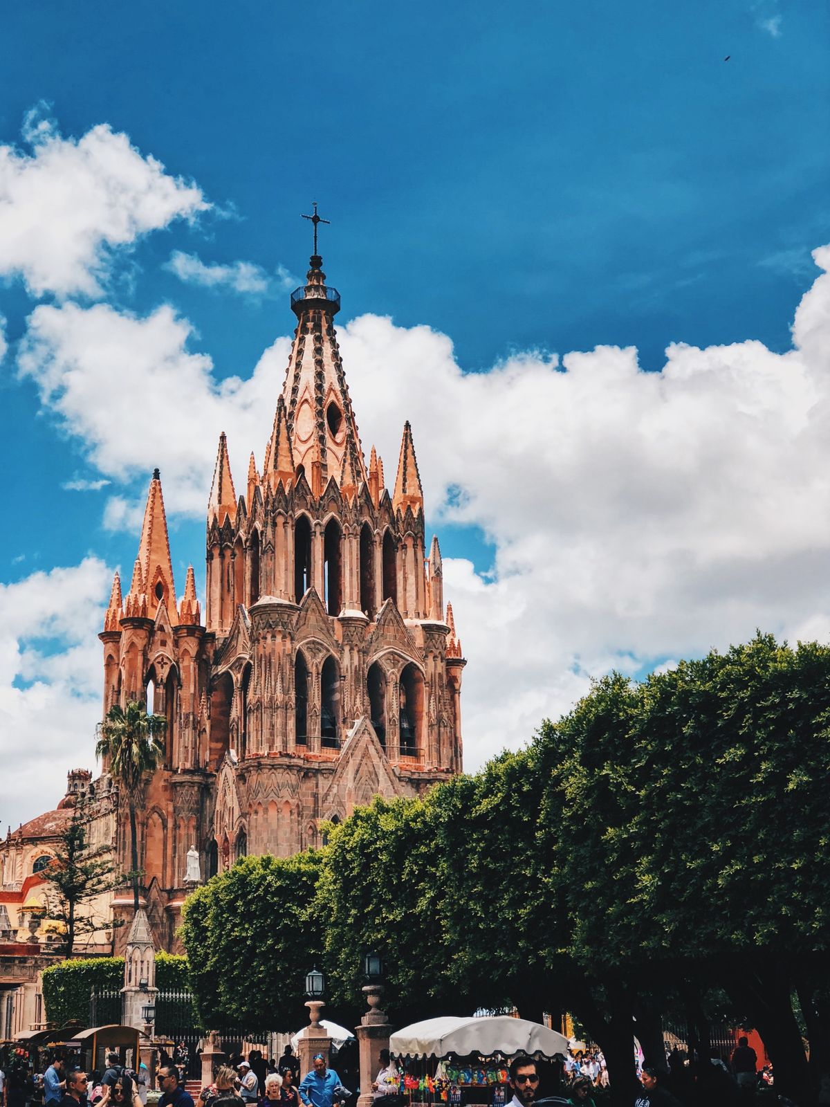 Gothic architecture of Parroquia de San Miguel Arcángel with vibrant blue skies in San Miguel de Allende, Mexico.