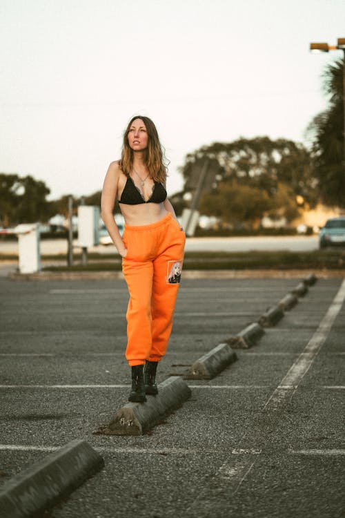 Woman in Black Bra and Orange Pants · Free Stock Photo