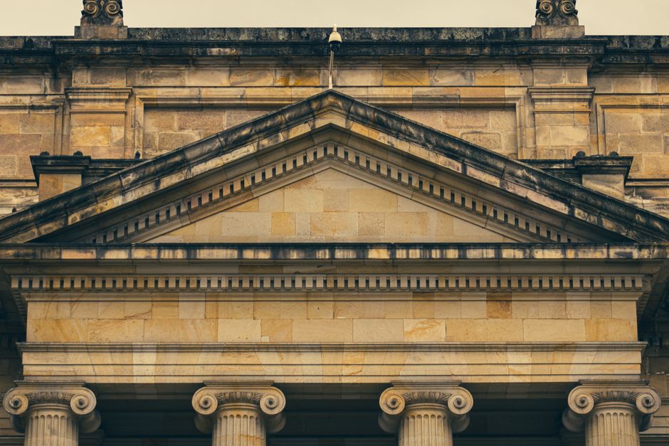 Close-up of a historic building showcasing elegant classical architecture and columns.