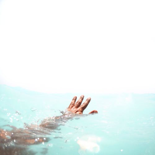 Person Reaching Out on Water