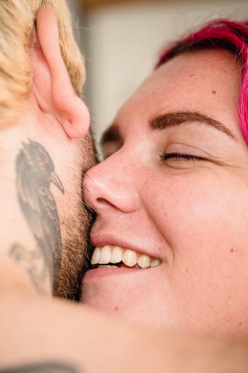 Close-up of Man and Woman Hugging Kissing