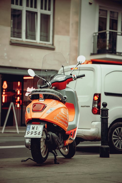 Orange Motorcycle Parked on the Street