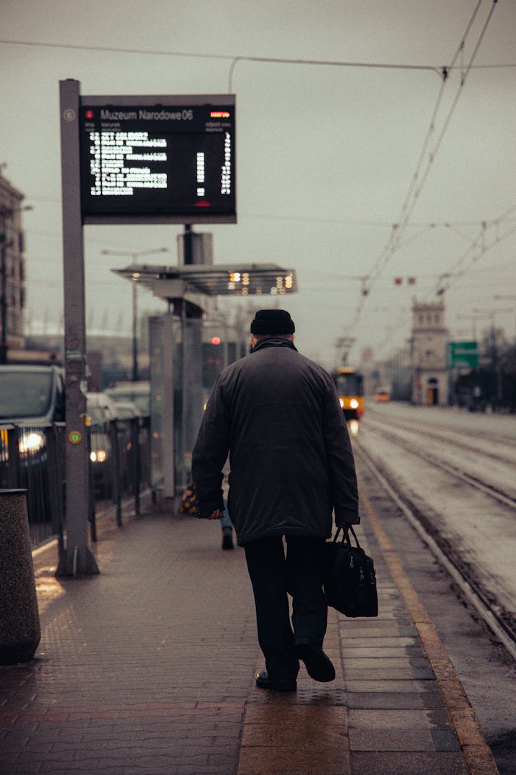 A Man Walking On The Street